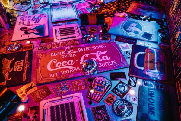 red coca cola signage surrounded by other signages